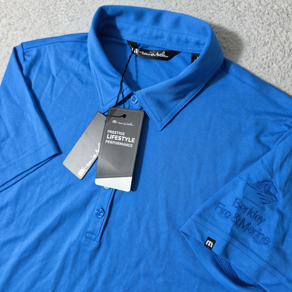 NEW TravisMathew Polo Womens L Classic Blue Oceanside Solid Stretch Berkley Logo